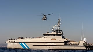 Helicopters and coast guard boats are involved in the search and rescue operations.