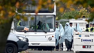 A view of people thought to be migrants at the Manston immigration short-term holding facility in Thanet, England Monday, Oct. 31, 2022. 