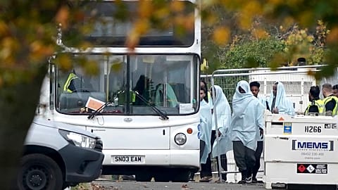 A view of people thought to be migrants at the Manston immigration short-term holding facility in Thanet, England Monday, Oct. 31, 2022. 
