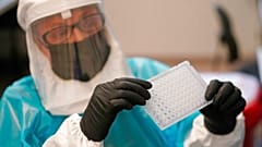 Microbiologist demonstrates how monkeypox is tested for at the Utah Public Health Laboratory