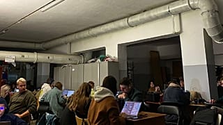Employees of Headway work as they shelter in a Kyiv basement during a missile strike on the capital.