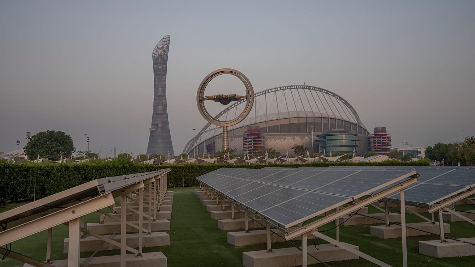 Solar panels stand on grounds in front of Khalifa International Stadium, which will host matches during the FIFA World Cup 2022, in Doha, Qatar, Saturday, Oct. 15, 2022.