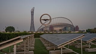 Solar panels stand on grounds in front of Khalifa International Stadium, which will host matches during the FIFA World Cup 2022, in Doha, Qatar, Saturday, Oct. 15, 2022.