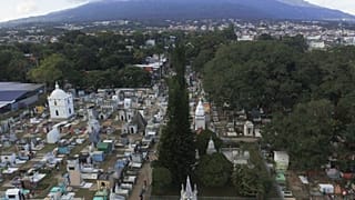 General view of the Nueva San Salvador Cemetery, with the San Salvador volcano in the background, during the Day of the Dead celebrations in Santa Tecla, El Salvador, Wednesda