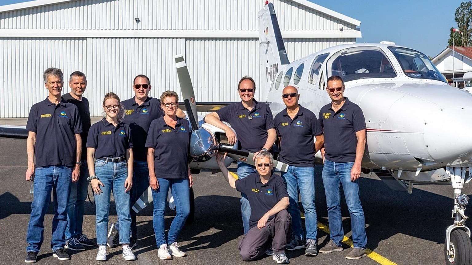 Some of Ukraine Air Rescue team members next to one of their aircraft