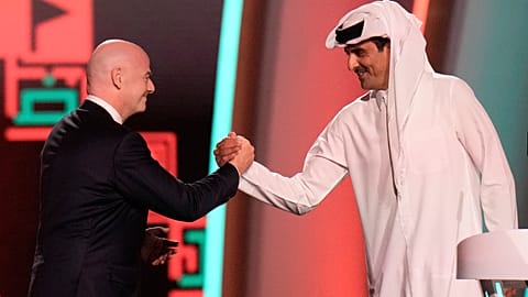 FIFA President Gianni Infantino, left, and Emir of Qatar Sheikh Tamim bin Hamad Al Thani shake hands before the World Cup draw, Doha, Qatar, Friday, April 1, 2022.