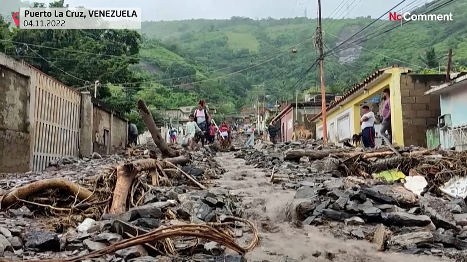Locals removing the debris left by the landslide. 