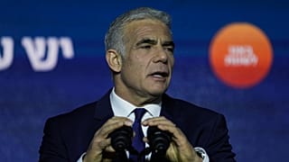 Israeli Prime Minister and the head of Yesh Atid party, Yair Lapid, speaks to his supporters at his party's headquarters in Tel Aviv, 2 November 2022