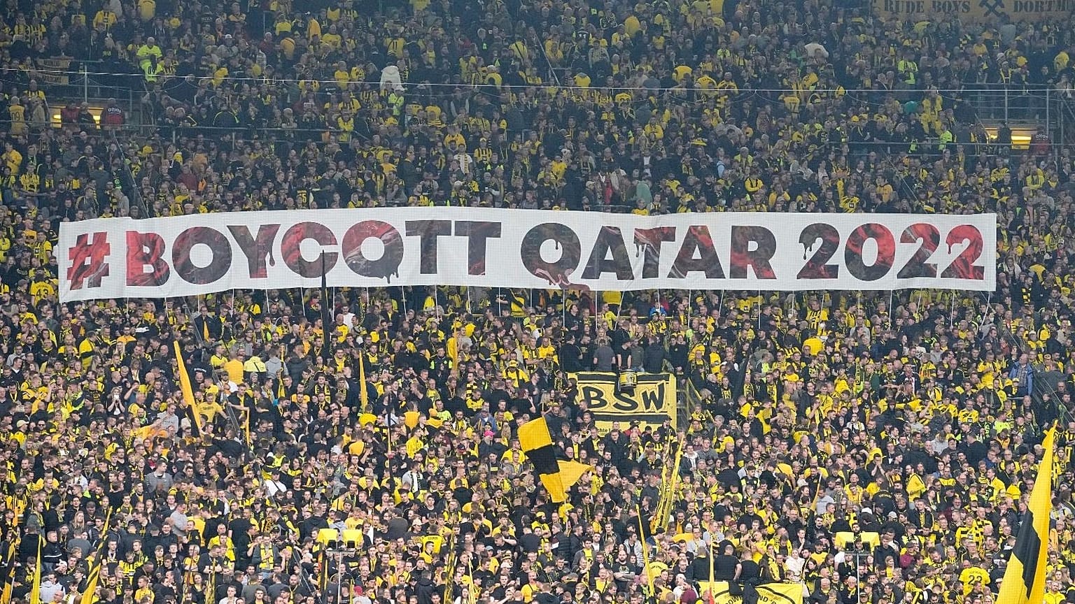 Fans display a banner during the German Bundesliga soccer match between Borussia Dortmund and VfB Stuttgart in Dortmund, Germany, Saturday, Oct. 22, 2022.