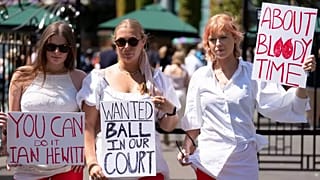 Campaigners from Address The Dress Code outside the main gate at Wimbledon - July 2022