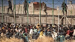 Hundreds of migrants tried to to scale the border fence separating Morocco from Mellila in June.