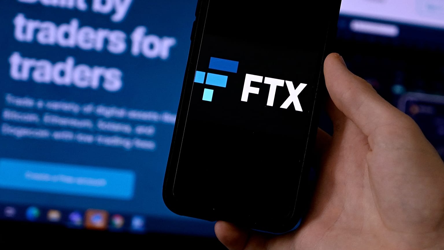 This illustration photo shows a smart phone screen displaying the logo of FTX, the crypto exchange platform.