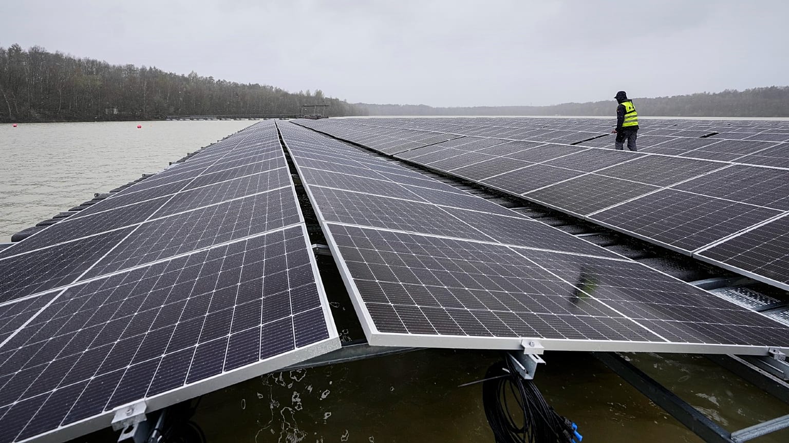 Solar panels are installed at a floating photovoltaic plant on a lake in Haltern, Germany, on April 1, 2022. 