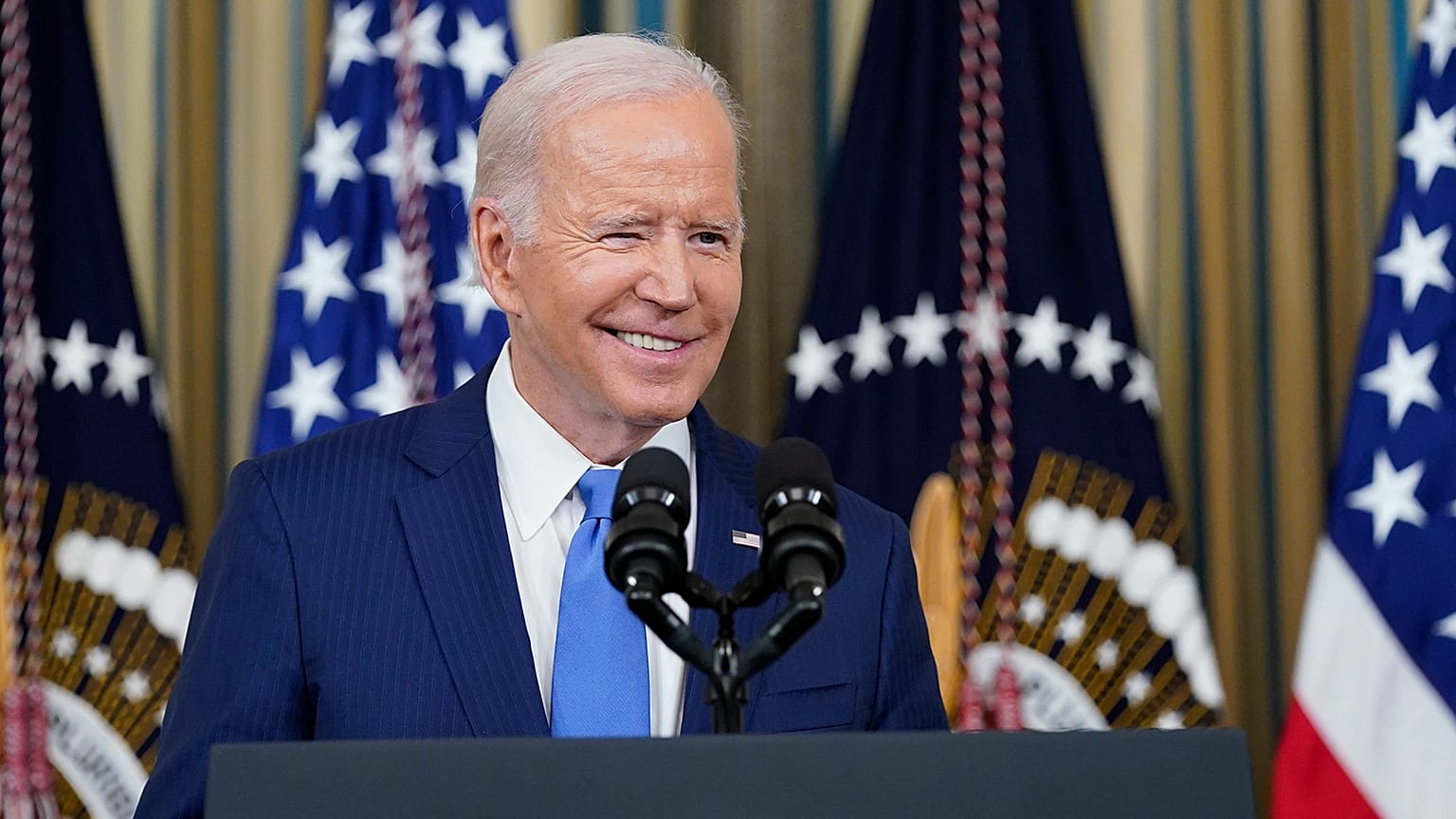 President Joe Biden arrives to speak in the State Dining Room of the White House in Washington, 9 November 2022