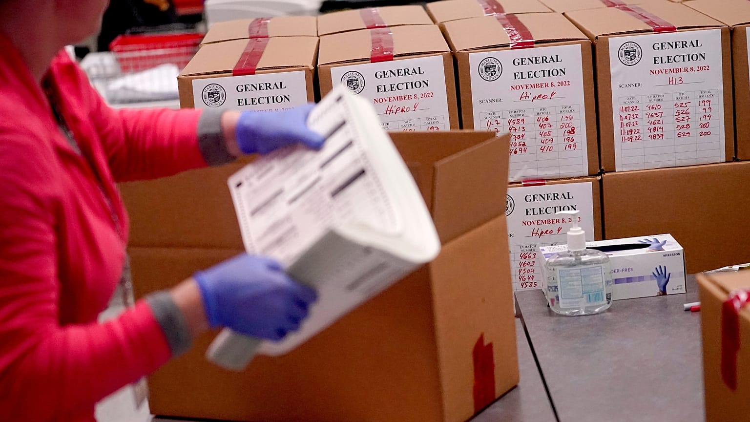 An election worker boxes tabulated ballots inside the Maricopa County Recorders Office, Wednesday, Nov. 9, 2022, in Phoenix.