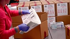 An election worker boxes tabulated ballots inside the Maricopa County Recorders Office, Wednesday, Nov. 9, 2022, in Phoenix.