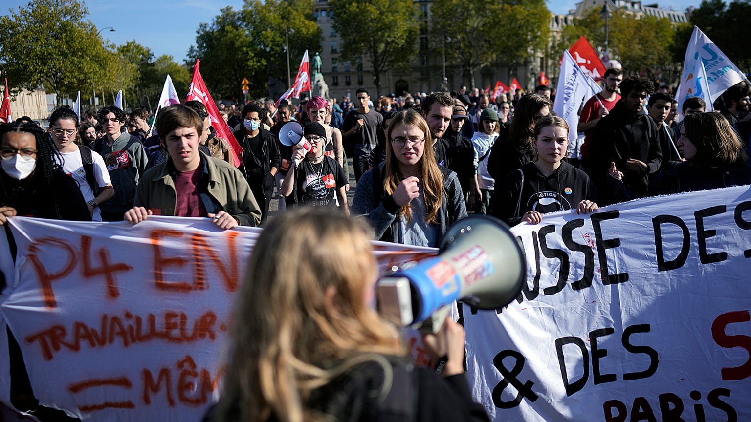 Protestors march during a demonstration in Paris, 27 October 2022