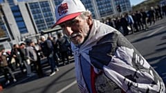 A supporter of Istanbul Mayor Ekrem Imamoglu, demonstrates in front of Anadolu courthouse in Istanbul, Turkey, Friday, Nov. 11, 2022.
