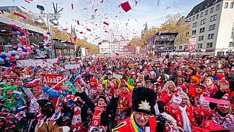 Carnival revellers celebrate at 11:11 with tens of thousands the start of the carnival season in the streets of Cologne, Germany,