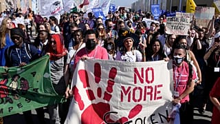 Акция экоактивистов у места проведения COP27 в Шарм-эш-Шейхе 12 ноября 2022