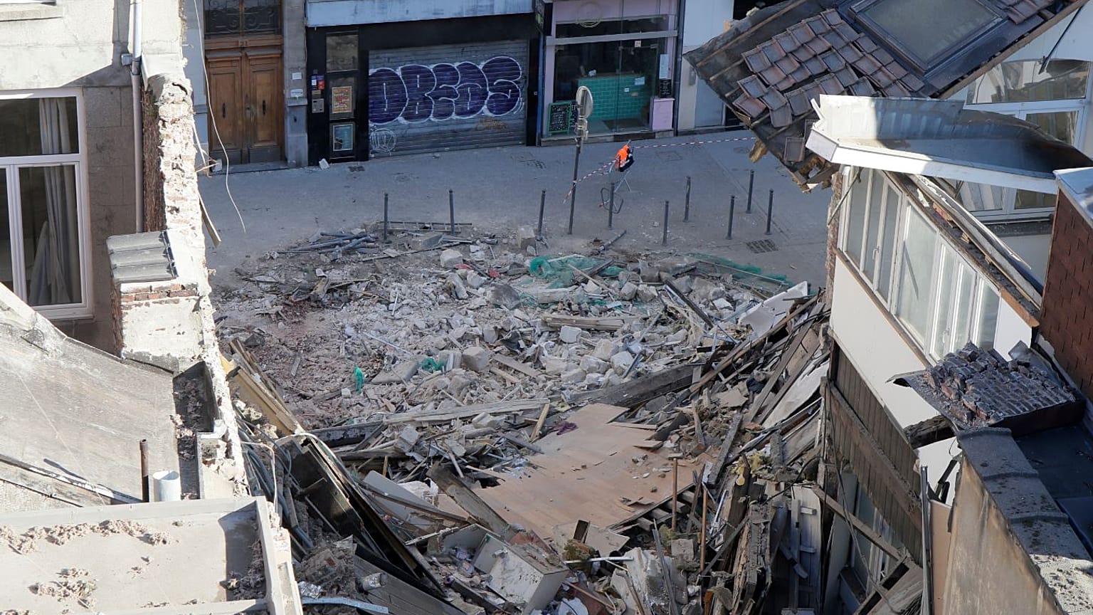 French police blocks access to the site of a collapsed building in the city of Lille, northern France, on November 12, 2022