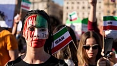 People stage a protest against the death of Mahsa Amini, a woman who died while in police custody in Iran, during a rally in central Rome, Oct. 29, 2022. 