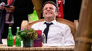 France's President Emmanuel Macron reacts during a conversation ahead of a working lunch at the G20 Summit in Nusa Dua, Bali, Indonesia Tuesday, Nov. 15, 2022.
