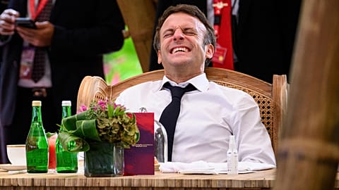 France's President Emmanuel Macron reacts during a conversation ahead of a working lunch at the G20 Summit in Nusa Dua, Bali, Indonesia Tuesday, Nov. 15, 2022.