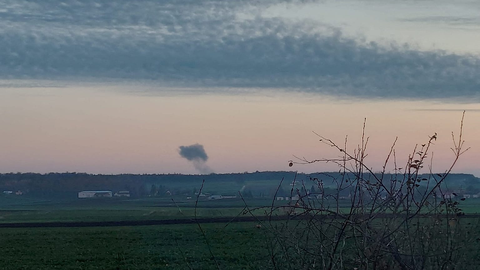 Smoke rises in the distance, amid reports of two explosions, seen from Nowosiolki, Poland, near the border with Ukraine 