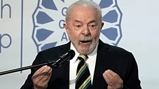 Brazilian President-elect Luiz Inacio Lula da Silva gestures while he speaks at COP27.