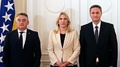 Members of Bosnia's newly elected tripartite presidency pose for a photo during the presidency inauguration ceremony in Sarajevo, 16 November 2022