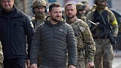 Ukrainian President Volodymyr Zelenskyy walks on central square during his visit to Kherson, Ukraine. Monday, 14 November 2022.