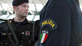 Italian police at an airport in Rome.