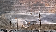 Workers use machinery to dig at a rare earth mine in the Baiyunebo mining district of Baotou in north China's Inner Mongolia Autonomous Region, Tuesday, July 6, 2010.
