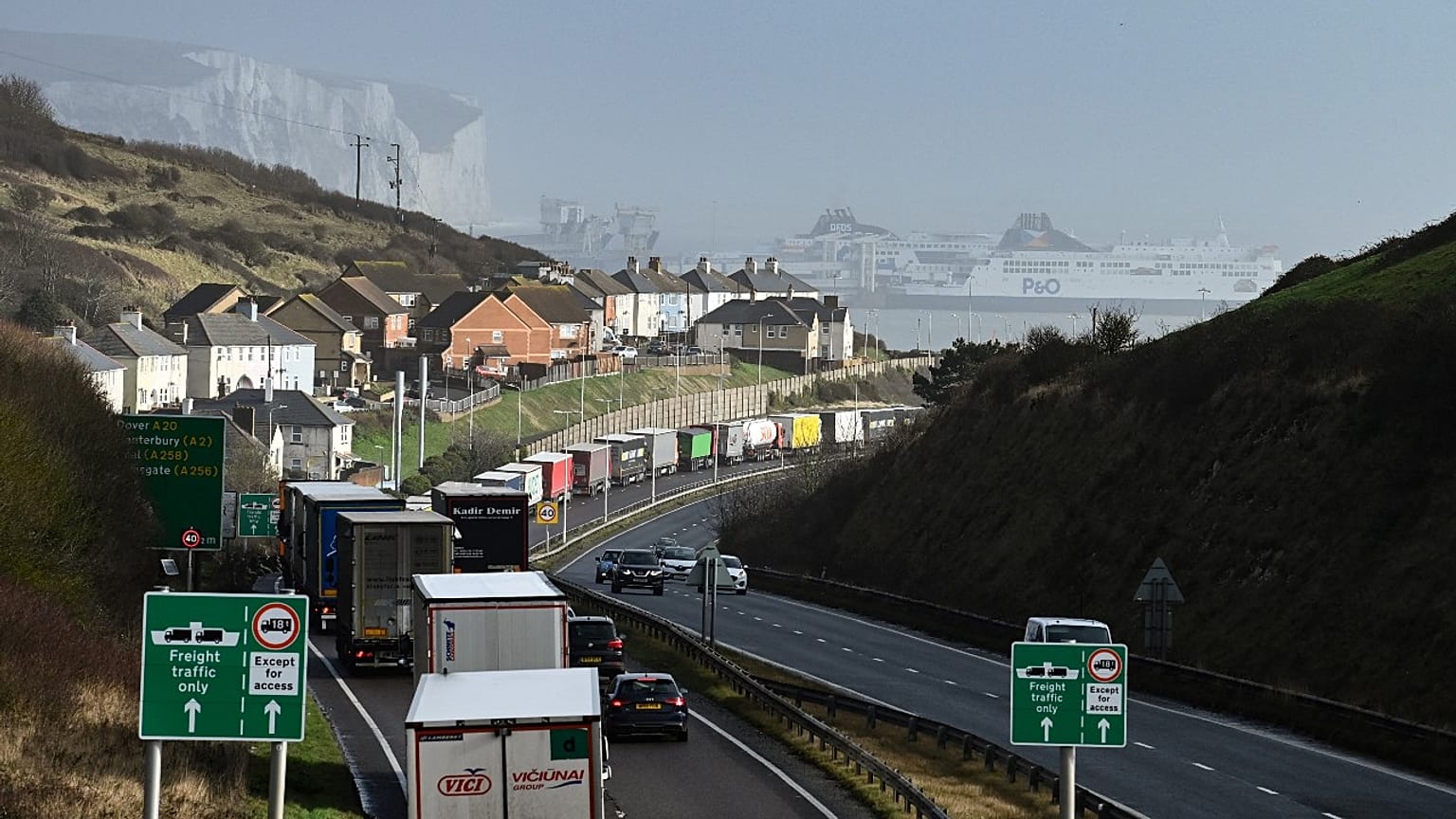 Lorries queue to embark on a ferry at the entrance of the Port of Dover, southeast England, on February 16, 2022. Britain's trade with the EU has been dented by Brexit. 
