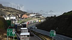 Lorries queue to embark on a ferry at the entrance of the Port of Dover, southeast England, on February 16, 2022. Britain's trade with the EU has been dented by Brexit. 