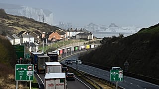 Lorries queue to embark on a ferry at the entrance of the Port of Dover, southeast England, on February 16, 2022. Britain's trade with the EU has been dented by Brexit. 