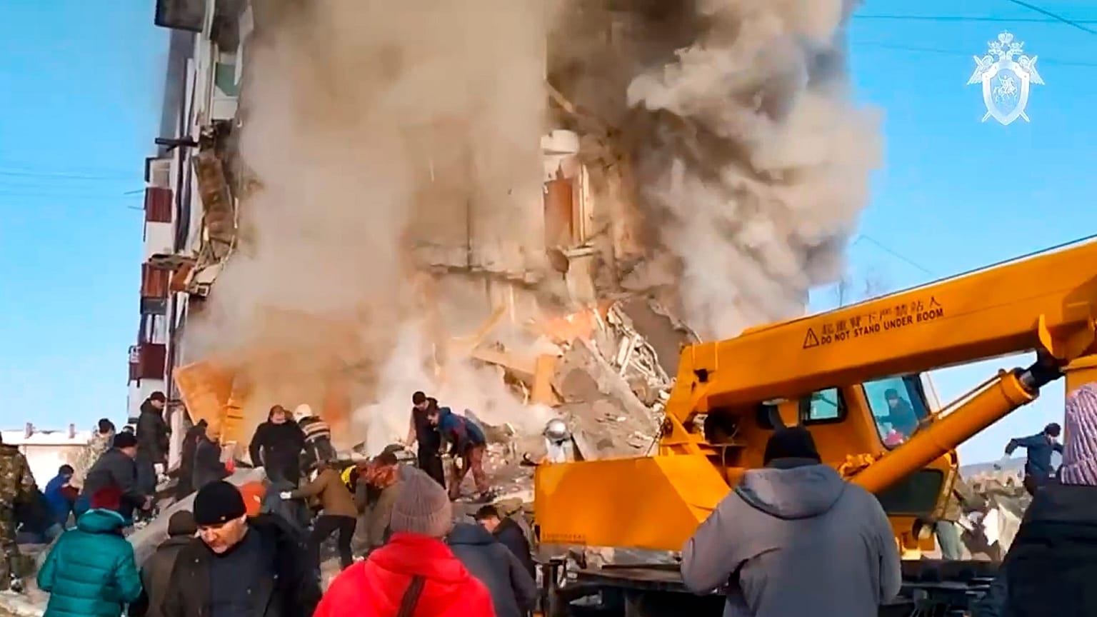 emergency situation ministry employees working at the scene of the collapsed apartment building in Tymovskoye,