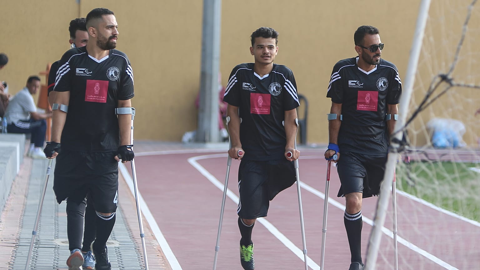 Players from the Amputee football team walking in the football field in Gaza.