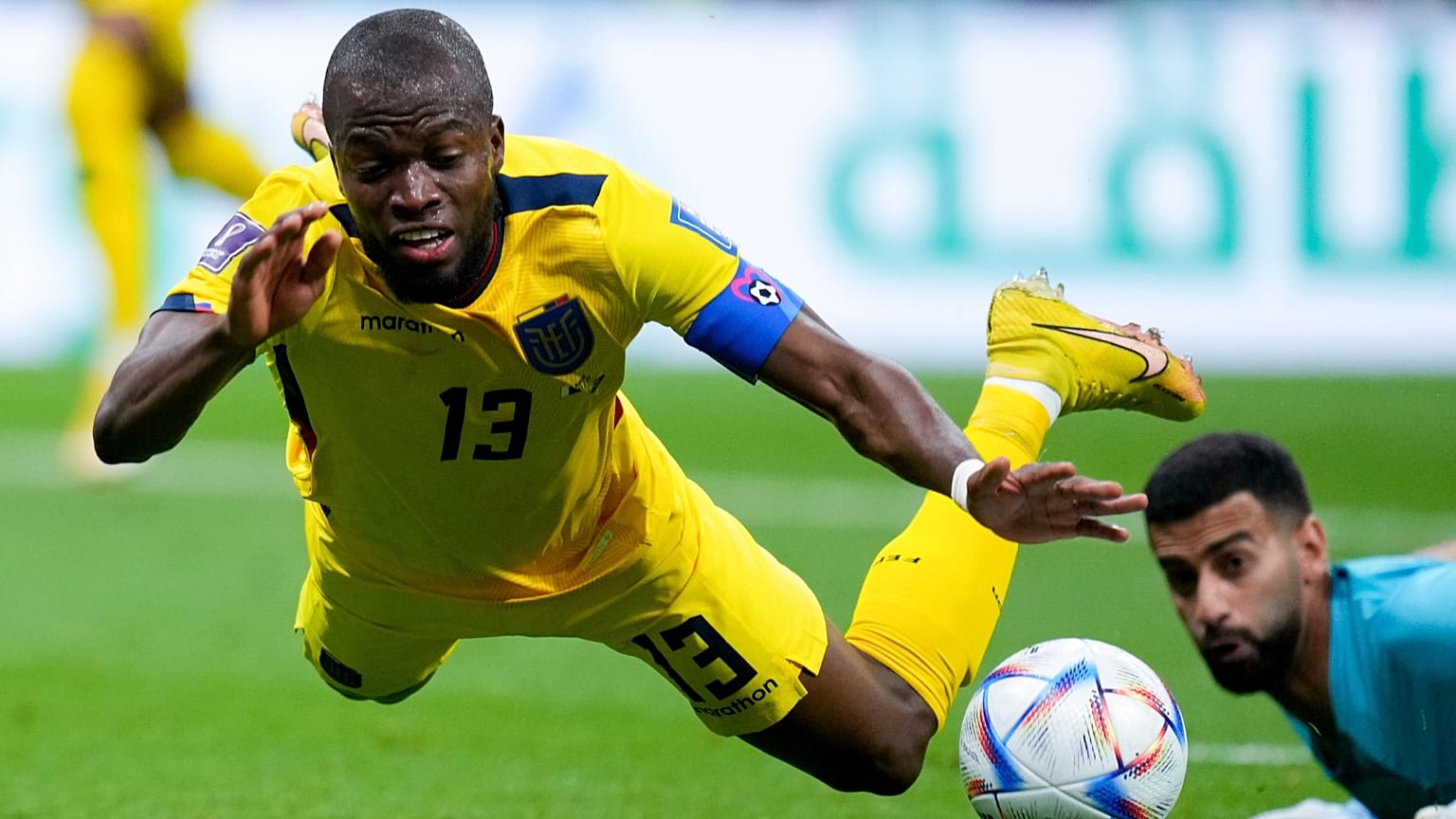 Ecuador's Enner Valencia falls, fouled by Qatar's goalkeeper Saad Al Sheeb, during a World Cup group A soccer match, 20 November 2022