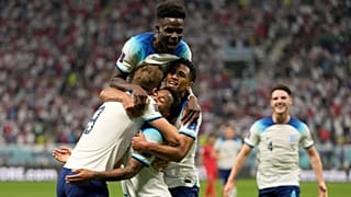 England's Raheem Sterling celebrates with teammates after scoring his side's third goal