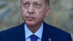 Turkey's President Recep Tayyip Erdogan looks up during a joint news conference with German Chancellor Angela Merkel in 2021
