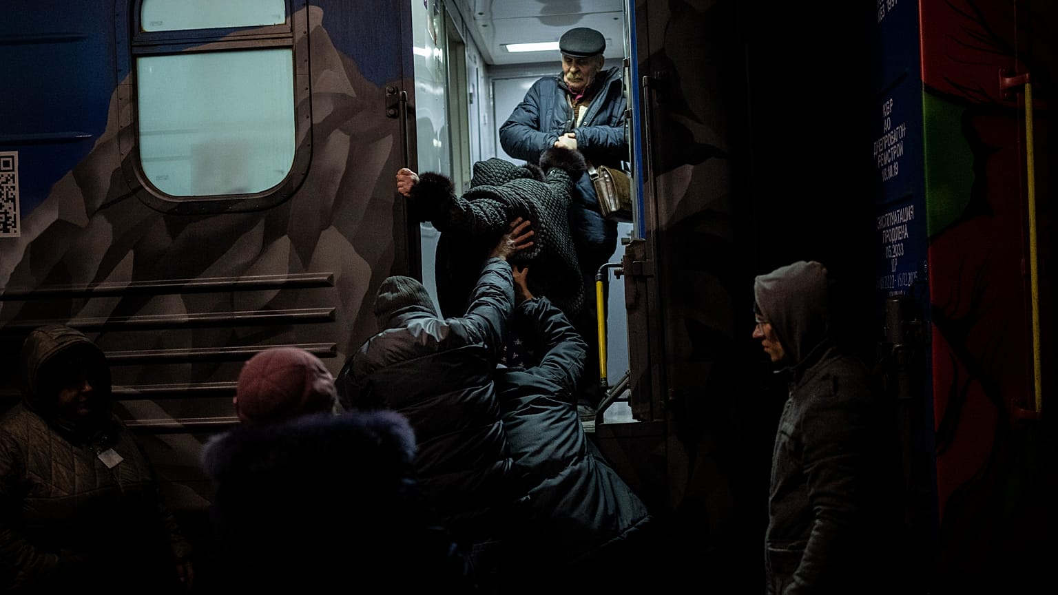 Ukrainians board the Kherson-Kyiv train at the Kherson railway station, southern Ukraine.