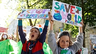 Child activists join a march through Westminster during a 'climate strike' demonstration, part of the global 'Fridays for Future' movement 