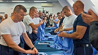 Serb police officers took off their uniforms in the town of Zvecan, Kosovo, Saturday, Nov. 5, 2022.