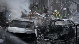 Ukrainian State Emergency Service firefighters work to extinguish a fire at the scene of a Russian shelling in the town of Vyshgorod outside the capital Kyiv, Ukraine