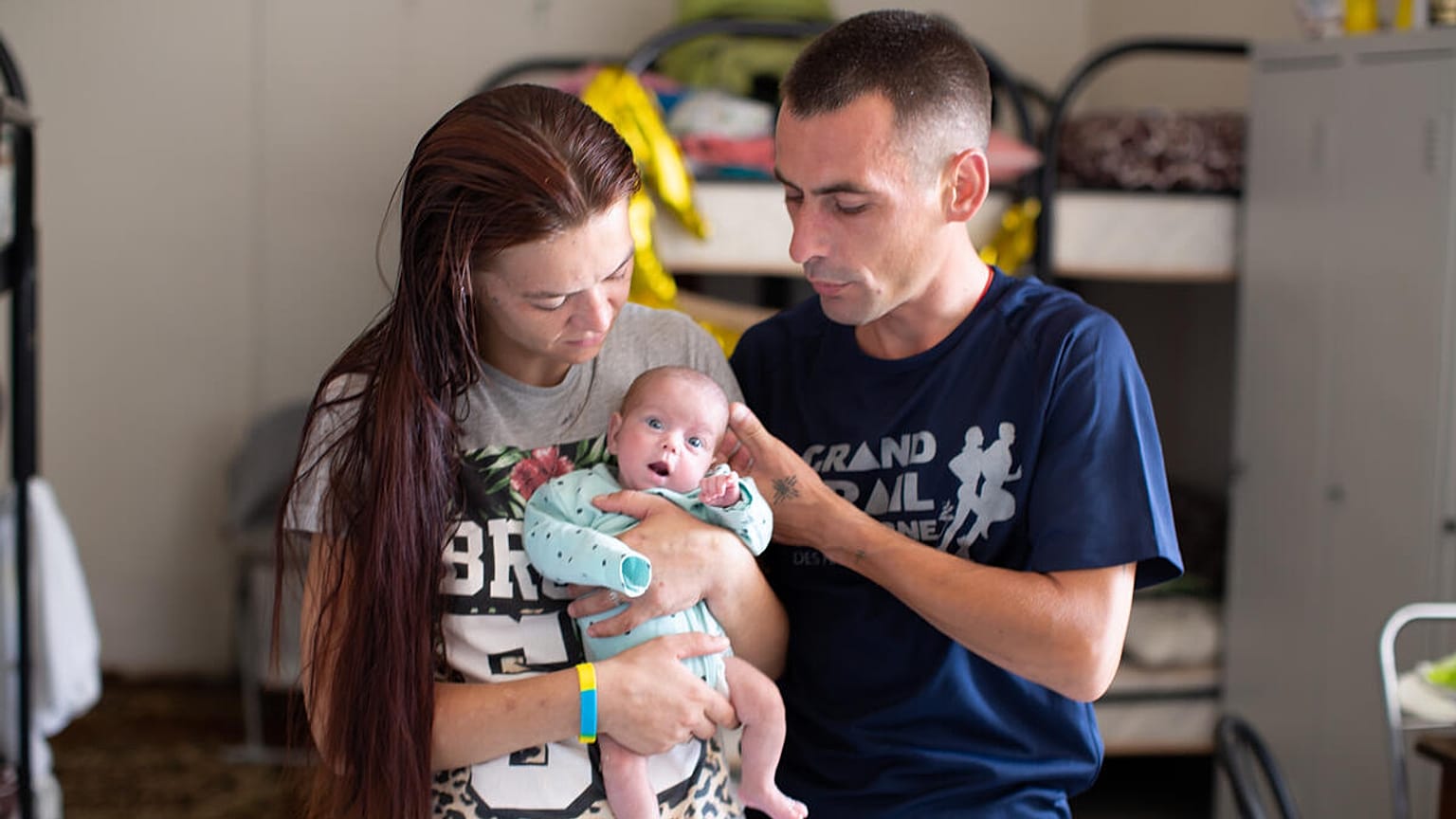 Antonina* and Andriy* with their baby premature Ganna* in a collective centre in Dnipro, eastern Ukraine.