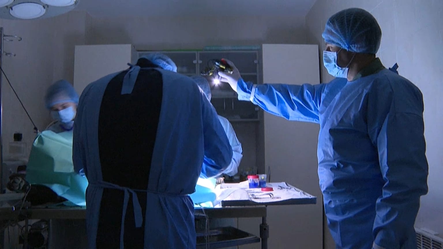 Vet Oleksiy Yankovenko and his team performing surgery on a dog.