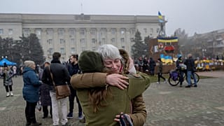 A woman hugs her friend who is a soldier in Ukraine army on November 21, 2022, in Kherson, amid the Russian invasion of Ukraine.
