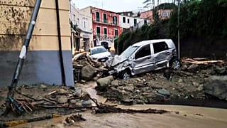 Destroyed cars are pictured in Casamicciola in the southern Ischia island on November 26, 2022, following heavy rains that sparked a landslide.
